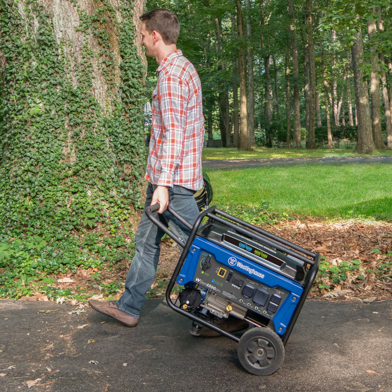 Westinghouse | WGen5300DFv portable generator being pulled down a driveway.