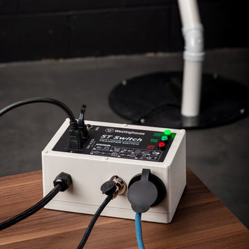 Westinghouse | ST Switch sitting on a table with a sump pump in the background.