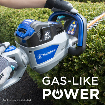 Closeup of 40V hedge trimmer showcasing handles and body of the unit. The blades are up against a bush. Text in the lower right corner reads "gas-like power"