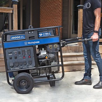 Westinghouse | WGen20000 portable generator shown being wheeled across concrete