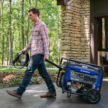 Westinghouse | WGen9500 portable generator being pulled down a driveway.